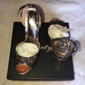 Rose gold and black lace stilettos